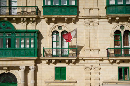 VALLETTA, MALTA - DEC 31st, 2019: Malta flag, city street and life, urban view and architectureのeditorial素材