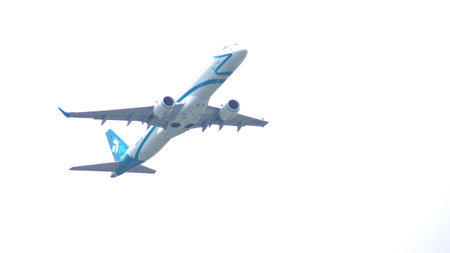 MUNICH, GERMANY - 11 OCTOBER 2015: Jet plane Embraer E-Jet ERJ-195 of Air Dolomiti Italian airlines take off from Munich international passenger airport and gains altitudeのeditorial素材