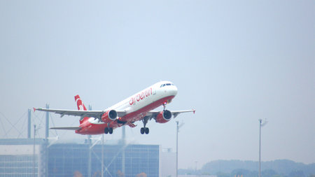MUNICH, GERMANY - 11 OCTOBER 2015: Passenger plane of Air Berlin low-cost airline touching down runway at Munich international airport MUCのeditorial素材