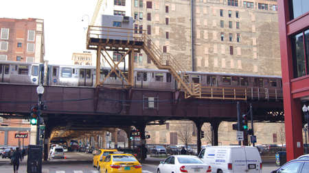 CHICAGO, ILLINOIS, UNITED STATES - DEC 11, 2015: Famous elevated train Chicago Loop above the streets of Chicagoのeditorial素材