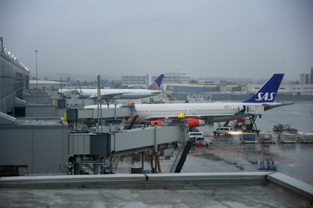 SAN FRANCISCO, CALIFORNIA, UNITED STATES - NOV 28, 2018: Two long-haul aircraft parked at the gates of San Francisco International Airport SFO in rainy weatherのeditorial素材