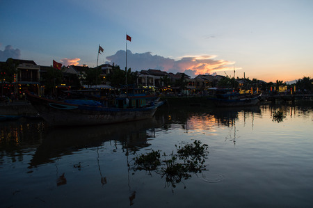 Picturesque Street, River and Boats in the Evening, Hoi An, Vietnamのeditorial素材