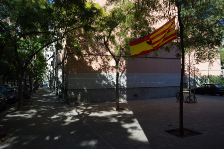 Spanish Flag in Residential Neighborhood of Barcelona during Catalonian Independence Considerations, Barcelona, Spainのeditorial素材