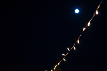 Fairy Lights and Moon at Night in Mostar, Bosnia and Herzegovinaの写真素材