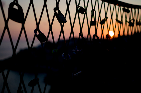 Love Padlocks on a Fence during Sunset in Dubrovnik, Croatiaの写真素材