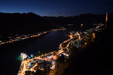 Panorama of Kotor Bay with Mountain Scenery and Cruise Ship Seen from Lookout at Night, Montenegroの写真素材