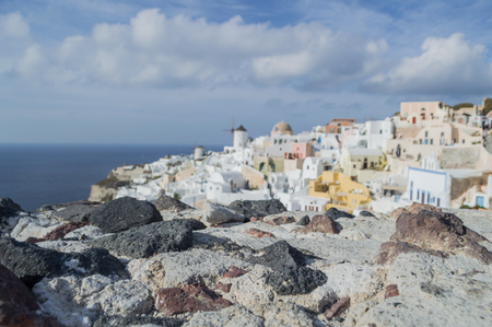 Whitewashed Houses and Windmill on Cliffs with Sea View in Oia, Santorini, Cyclades, Greeceの写真素材