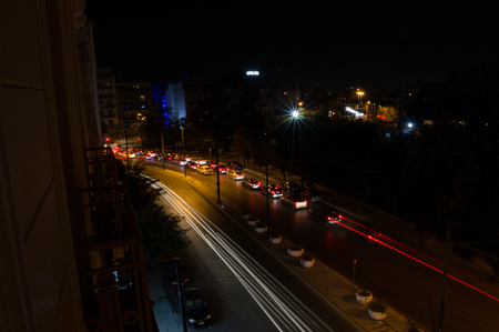 Car Headlights Forming Lines in Long Exposure Shot at Night in Athens, Greeceの写真素材