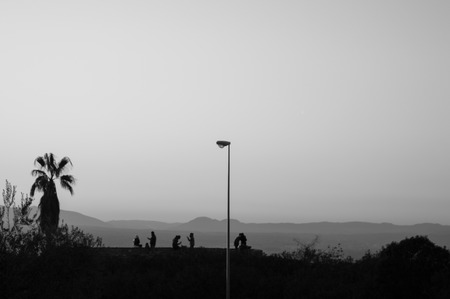 People Watching Sunset at Mirador del Barranco del Abogado Lookout in Granada, Spainの写真素材