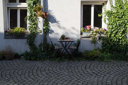 Table and Chairs in Front of Dutch House in Maastricht, Netherlands