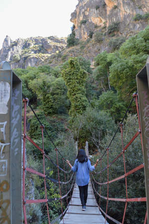 Bridge across Canyon during Circular del RÃ­o Monachil Hike near Granada, Spainの写真素材