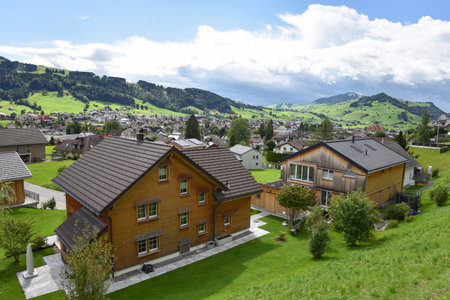 Alpine Mountain Landscape with Traditional Homes in Appenzellerland Region, Switzerlandの写真素材