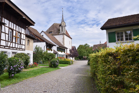 Traditional Homes with Flowers and Church in the Countryside near Zurich, Switzerlandの写真素材