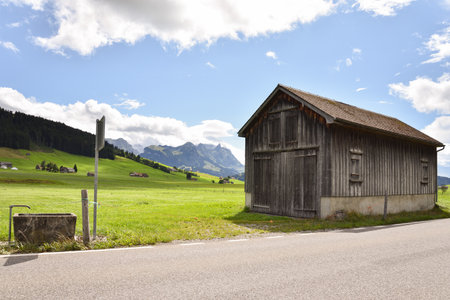 Alpine Mountain Landscape with Barn in Appenzellerland Region, Switzerlandの写真素材