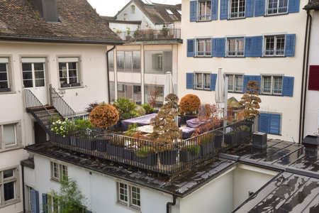 A Rooftop Terrace between Traditional Houses at Lindenhof Lookout Point in Zurich, Switzerlandの写真素材