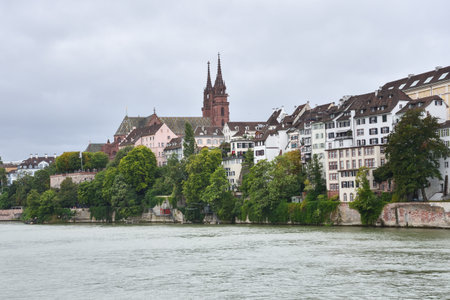 Traditional Houses and Church along Riverfront in Basel, Switzerlandの写真素材