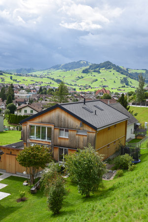 Alpine Mountain Landscape with Traditional Homes in Appenzellerland Region, Switzerlandの写真素材