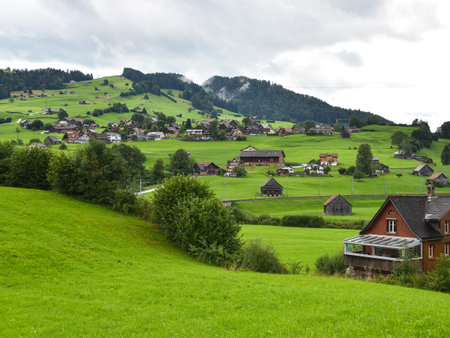 Alpine Mountain Landscape with Traditional Homes in Appenzellerland Region, Switzerlandの写真素材