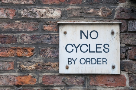  No cycles by order  sign on brick wallの写真素材
