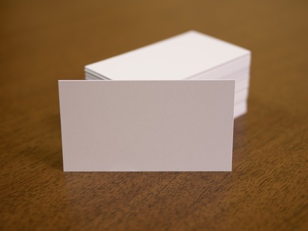 Identity design mockup for corporate presentation. Blank business cards on a wooden background
