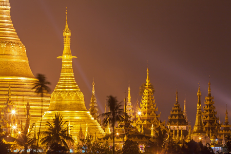 Yangon, Myanmar view of Shwedagon Pagoda at night with spotlight reflects gold surface of The pagodaのeditorial素材