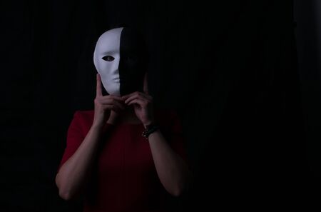 Black and white mask. Dark and light side. Be yourself, you do not need a mask. Suitable for mental health, life coach.の写真素材