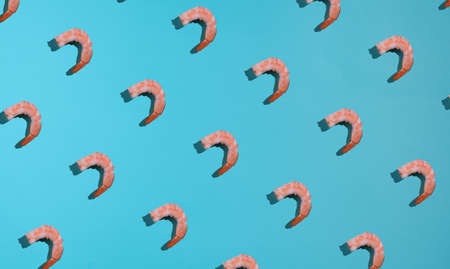 Cooked shrimp meat pattern on a blue background.の写真素材