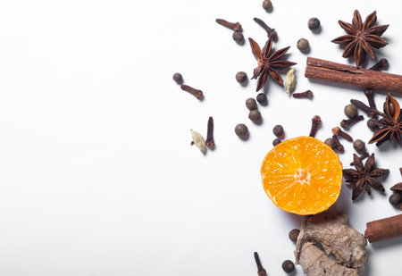 Various ingredients for mulled wine, fruits and spices.flat lay. Place for text. White backgroundの写真素材