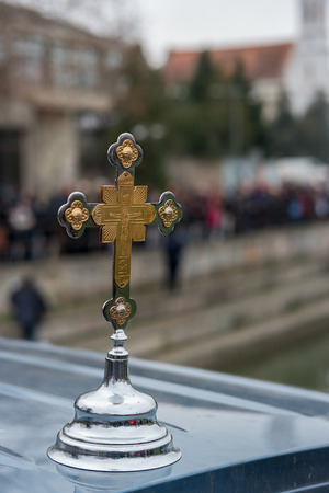 Zrenjanin, SERBIA - January 19, 2018: Annual transition Epiphany cross which is to be handed over to fastest swimmer in race for wooden cross. Orthodox Christians around the world to take dip in the water to mark Epiphany, cleansing themselves with water のeditorial素材