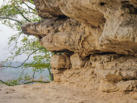 Sandstone rocks on one of the hiking trails in the Bohemian Switzerland National Park, Czech Republic. View through the trees in the valley.の写真素材