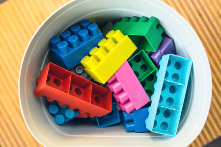 High Angle View On Brick Block construction Toys in The Bucketの写真素材