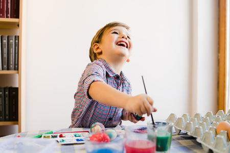 Little Boy using Water Colors To Paint At Homeの写真素材