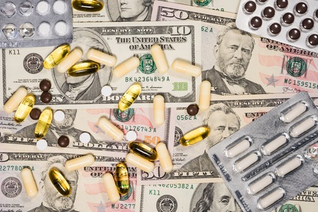High Angle View on the Dollars and Pills Drugs Industry