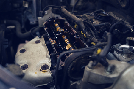 Close Up on car engine opened at the garage workshopの写真素材