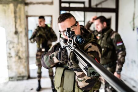 SWAT special military police force airsoft in combat action anti Terrorist intervention combat war game battleの写真素材