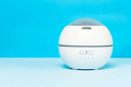 Electric White air purifier on th blue background with copy space