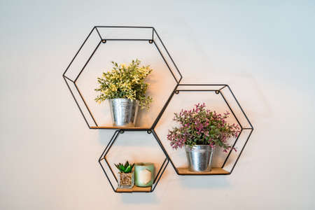 Close up on wall decoration metal buckets with flower vegetation abstract backgroundの写真素材