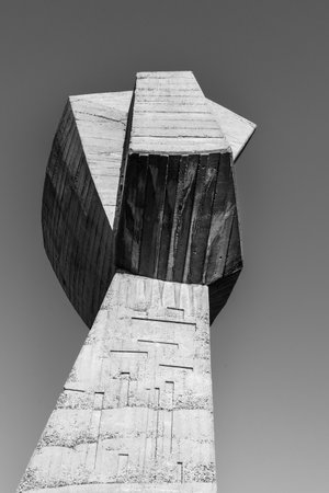 August 2020 - Bubanj Nis, Serbia: Socialist Brutalism Modernism abandoned communist huge concrete monument in shape of fists - symbol of resistance of partisans against fascism black and white photoのeditorial素材