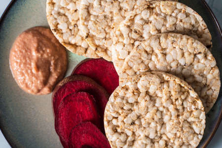 Crispy puffed rice cakes on plate - top view on healthy vegetarian or vegan breakfast gluten free