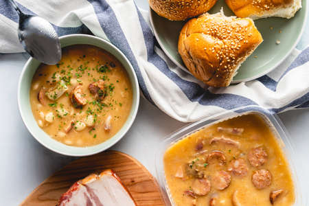 Kidney Beans soup with smoked sausage and bacon in plate on the table
