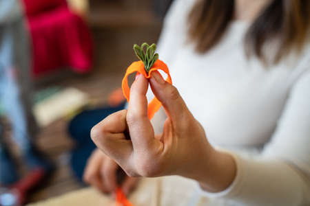 Close up on hands of unknown caucasian woman making decorative products at home leisure activity hobby arts and craftsの写真素材