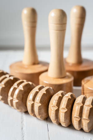 Wood massage maderotherapy madero therapy wooden rolling pin or battledore tools for anti cellulite treatment to stimulate the lymphatic system and improve circulation conceptの写真素材