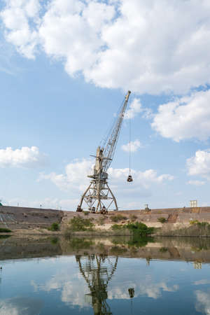 Heavy large industrial crane lifter at abounded port in sunny dayの写真素材