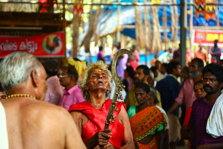 Kerala, India - 23 may 2017: A frenzied mob of devotees led by oracles walk around the temple,...