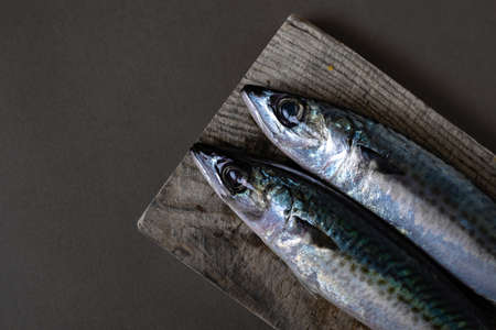 Beautiful photography two fish  closeup photo, cutting board, woodenの写真素材
