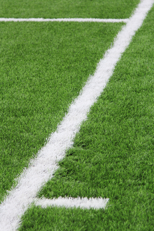 Artificial turf with markings on a football field. Sports background.の写真素材