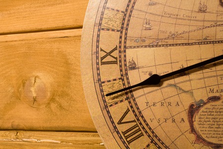 Large yellow clock on a wooden wall without one hand