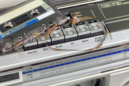 Old and  retro audio cassete player with cassette on itの写真素材