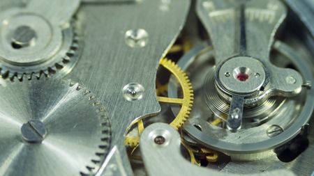 The clockwork of gold and silver vintage antique clock closeの写真素材