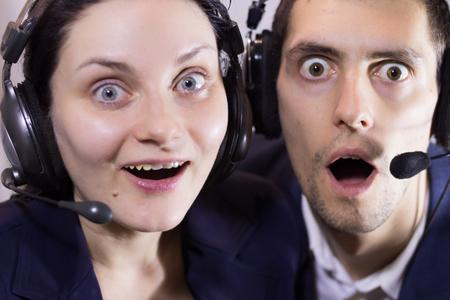 Dispatchers man and woman in a call center fooling around